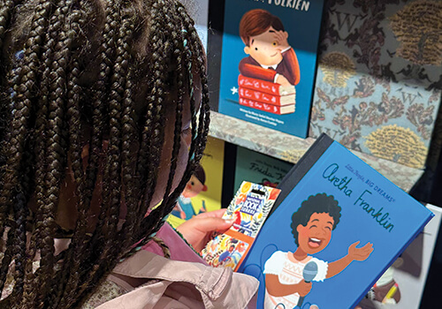 Girl browsing in a bookshop